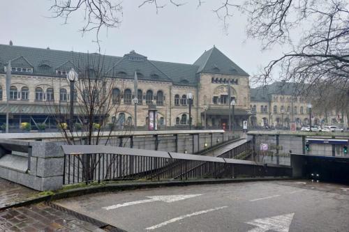 a large building with a fence in front of it at ibis Metz Centre Gare in Metz