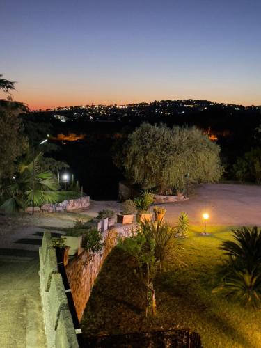 a view of a park at night with a street light at Room24 Relax & Wellness in Genzano di Roma