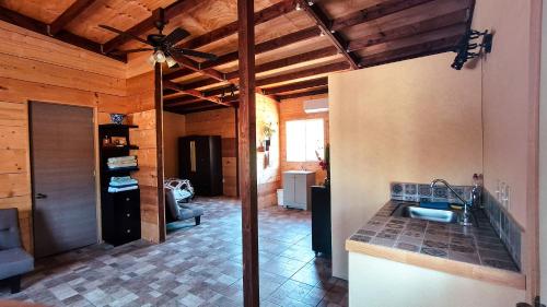 a kitchen with a sink and a ceiling at Jimmy & Yudy's place in El Triunfo