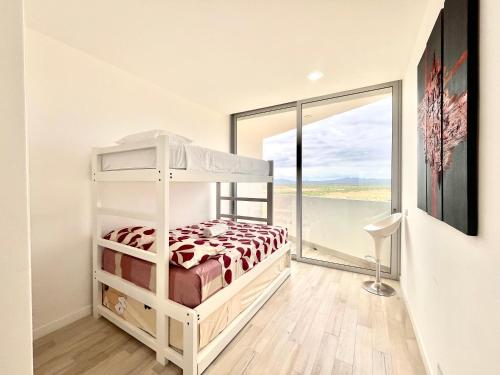 Postel nebo postele na pokoji v ubytování Exclusivo Dpto #1301 Playero en Karibao