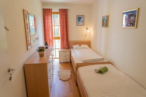 Ένα ή περισσότερα κρεβάτια σε δωμάτιο στο Johanna 4 by SMR Rauris Apartments - near Spa and Gondola