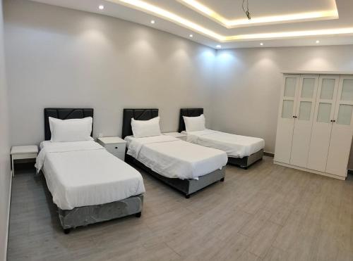 Postel nebo postele na pokoji v ubytování منتجع الكناري