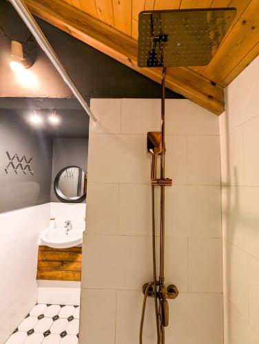 a bathroom with a shower and a sink at Villa Vasil Mertiri in Himare