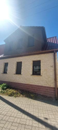 a brick building with windows on the side of it at Ferienhaus im Mansfelder Land in Wimmelburg