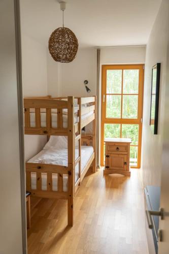 Una cama o camas en una habitación de Manuela 13 by SMR Rauris Apartments - inc Spa and near Gondola