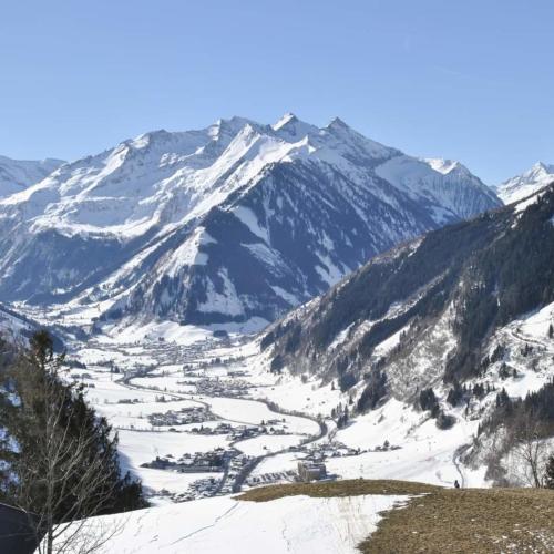 a snow covered mountain with a valley in the foreground at Christina 1 by SMR Rauris Apartments - inc Spa and near Gondola in Rauris
