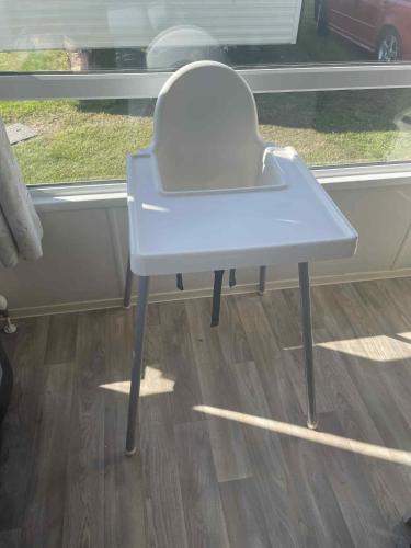 a white table sitting in front of a window at 14 Atlas Ruby Cherry tree in Gristhorpe