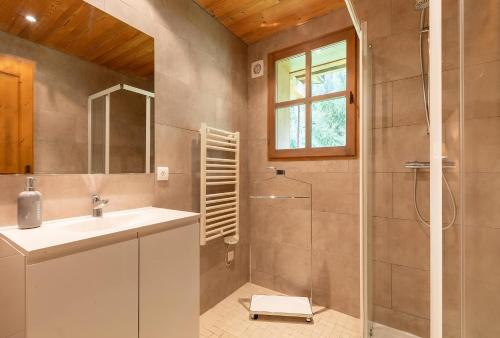 a bathroom with a sink and a shower at CASA-Chalet du Parc Cosy apartment in Tignes with garden in Tignes