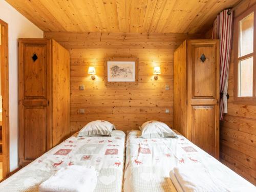 Ένα ή περισσότερα κρεβάτια σε δωμάτιο στο Casa-Chalet Brizolée avec vue sur le lac à Tignes