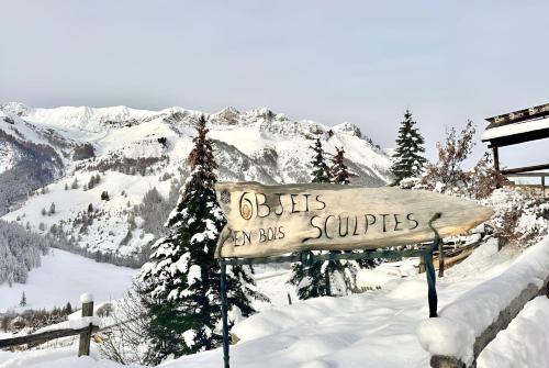 a sign that reads buicks my bus services in the snow at CASA-La Lobio foot of the slopes breathtaking views 4p in Saint-Véran