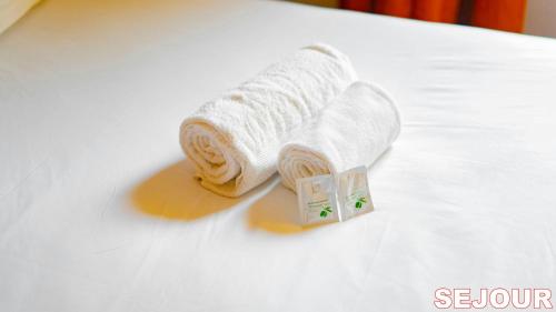 Ένα ή περισσότερα κρεβάτια σε δωμάτιο στο Paris Retreat 5 minutes from Hoche MetroParking