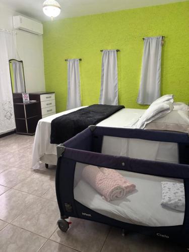 Ένα ή περισσότερα κρεβάτια σε δωμάτιο στο Casa do Sítio Palmeira - Pomerode