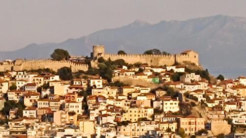a group of buildings on a hill with a castle at DS Port Seaview in Kavala
