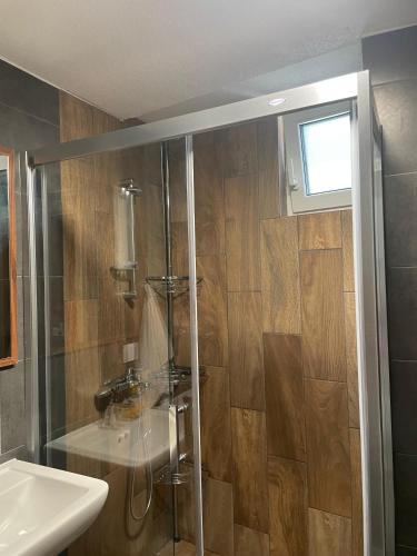 a bathroom with a shower and a sink at NovAS Apartment in Mavrovo