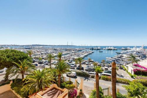 a view of a harbor with boats in the water at Grand Palais - 2 couchages - Studio - Vue Mer in Vallauris