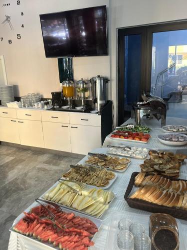 a buffet line with many different types of food at Hotel Riviera in Durrës