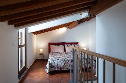 a bedroom with a bed in a room at Ma Maison 3 in Livorno