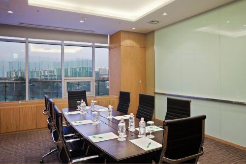 a conference room with a long table and chairs at Holiday Inn Gwangju by IHG in Gwangju