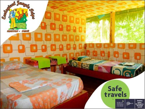 a room with two beds and a room with two tables at Ecological Jungle Trips & Lodge All Inclusive in Iquitos