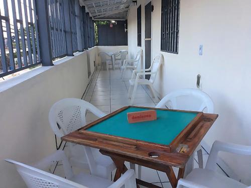 a table and chairs on the balcony of a restaurant at Miami Studios DR in Santo Domingo