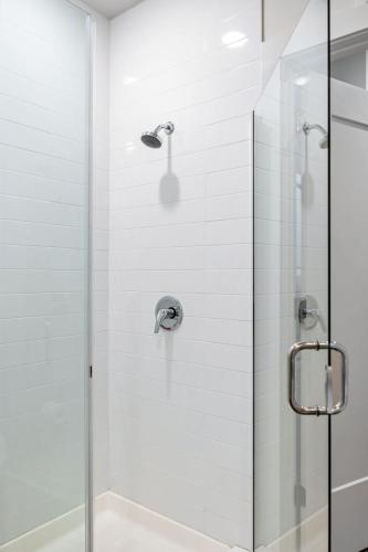 a bathroom with a shower with a glass door at Spectacular Apartments by BCA Furnished Apartments in Atlanta