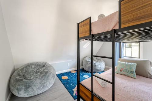 a bedroom with two bunk beds and a bed at Modern 3 Bed House in Black Rock in Bridgeport