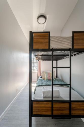 a bedroom with two bunk beds in a room at Modern 3 Bed House in Black Rock in Bridgeport