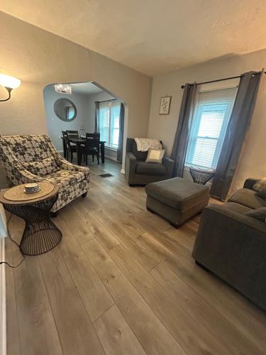 a living room with a couch and a table at Gorge Side Getaway 3 Bedrooms in Niagara Falls