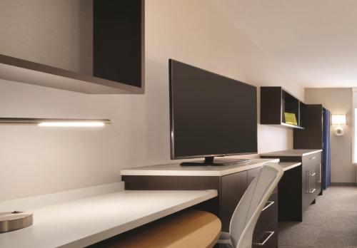 a computer monitor sitting on a desk in a room at Home2 Suites by Hilton Billings in Billings