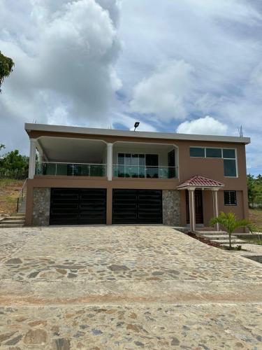 a house with a large driveway in front of it at Casa Finca El Encanto in Arroyo El Cabo