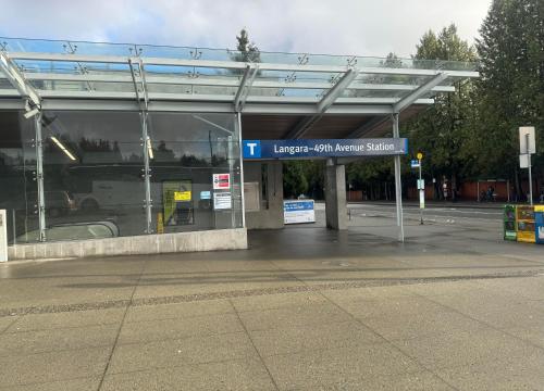 a gas station with a sign in front of it at Comfort cottage guest home near subway station, bus and downtown in Vancouver