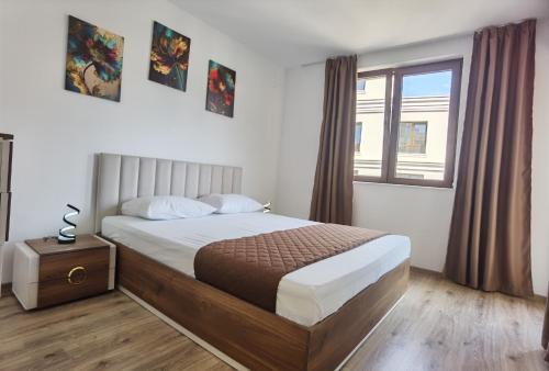 En eller flere senge i et værelse på Cabacum Pleasure Beachfront Apartments