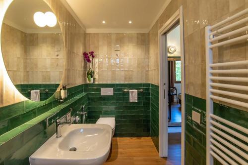 a bathroom with a sink and a mirror at Montelleri Residenza di Campagna in Vicchio