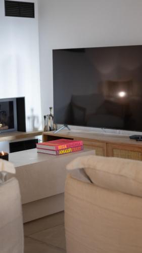 two books sitting on a counter in a kitchen at A Casa Catalina - Charming villa in Afa