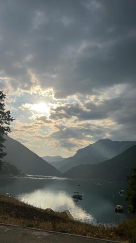 a view of a lake with boats in the water at PivApart in Pluzine