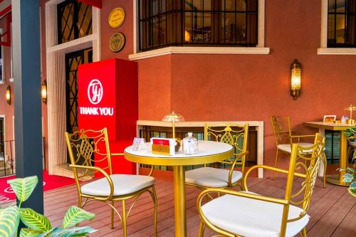 a patio with a table and chairs in a restaurant at Thank You Hotel Sultanahmet in Istanbul