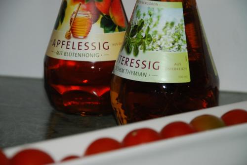 two bottles of apple sauce next to a box of cherries at Hotel Zum Granitzl in Mariapfarr