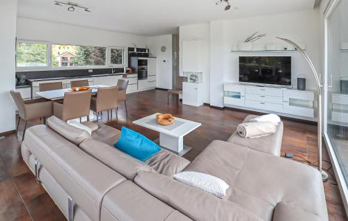 a living room with a couch and a table at Ferienwohnung Pörtschach 110M² in Pörtschach am Wörthersee