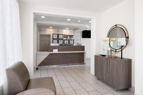 a store lobby with a mirror and a counter at Garner Hotel Virginia Beach North by IHG in Virginia Beach