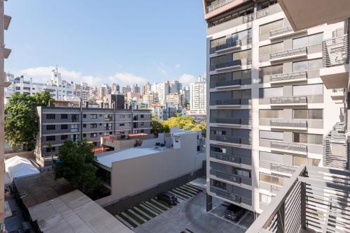 a view of a tall building in a city at Skyline Parque Moinhos by LikeHome in Floresta