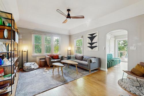 a living room with a couch and a ceiling fan at Balsam House in Baraboo