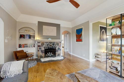 a living room with a fireplace and a couch at Balsam House in Baraboo