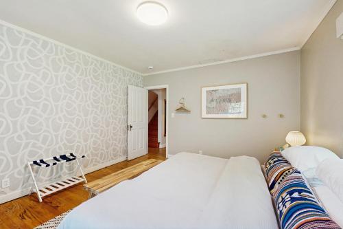a bedroom with two beds and a wall at Balsam House in Baraboo