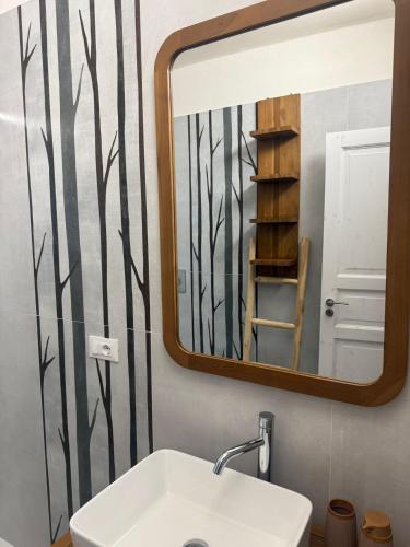 a bathroom with a sink and a mirror at Casale Guaceto in Carovigno