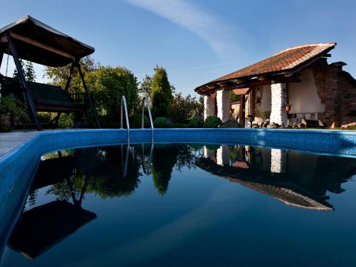 a swimming pool with a gazebo and a swimming pool at Ubytování BŘECLAV in Břeclav