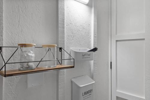 a shelf next to a toilet in a bathroom at Maple Pine w Hot Tub Pool Table 3min to Mount Snow in Dover