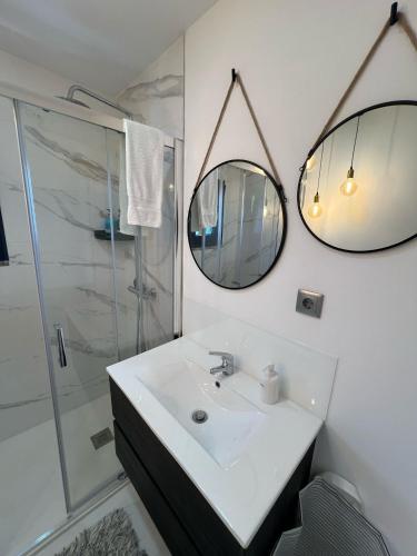 a bathroom with a sink and a shower at Sequeira Arantes Casa 2 in Terras de Bouro