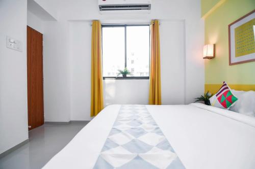 Ένα ή περισσότερα κρεβάτια σε δωμάτιο στο Hotel O Aakiyo Pashan Hill