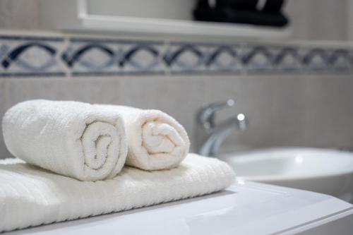 a pile of towels sitting on top of a sink at Juanvi's Corner in Costa de Adeje