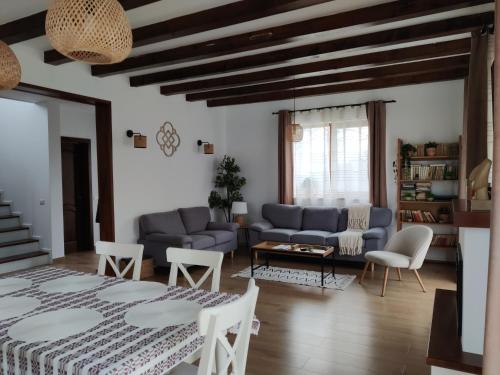 a living room with a bed and a couch at Ara Chalet in Bran